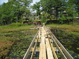 Patriot Place Boardwalk in MA with helical piles for foundation support