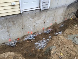 Helical piles for foundation underpinning